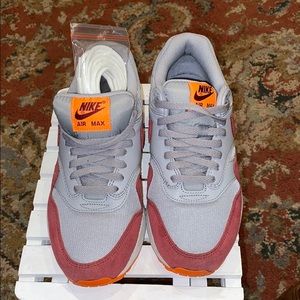 grey and red nike air max